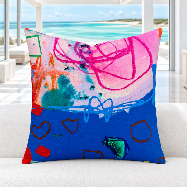 A Vibrant Life 4-b pillow in a bright white marble Turks and Caicos resort room