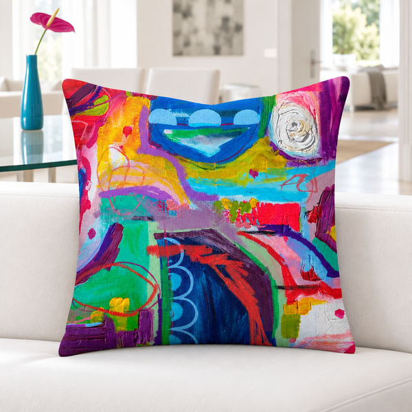 Destination Happiness pillow close-up on a white bench with one slim modern vase
