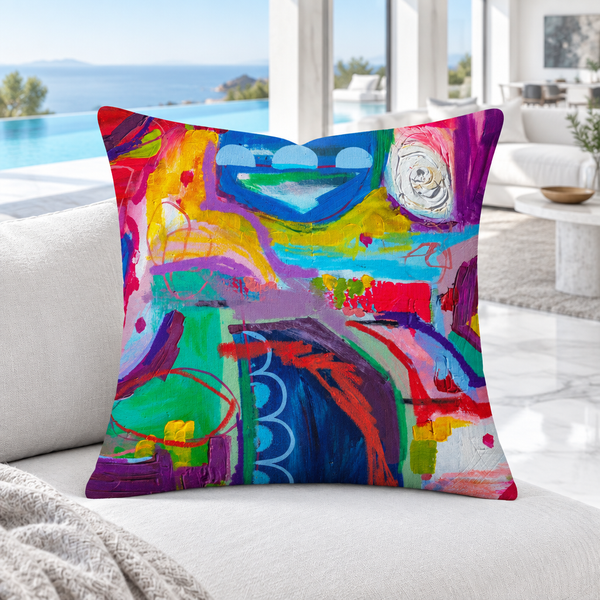 Destination Happiness pillow close-up on a white daybed in a hillside villa