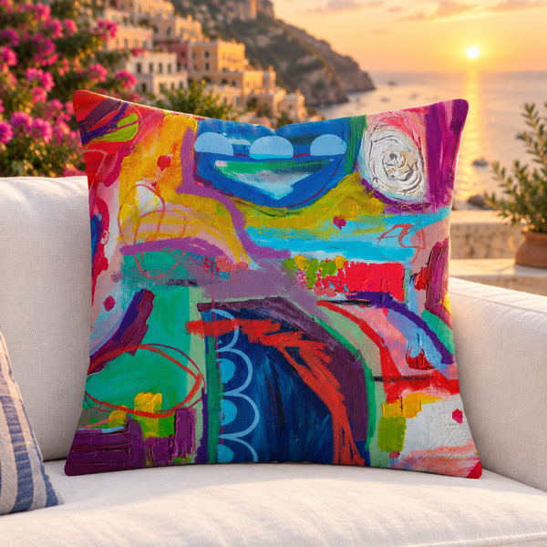 Destination Happiness pillow upright on a Positano terrace at sunset