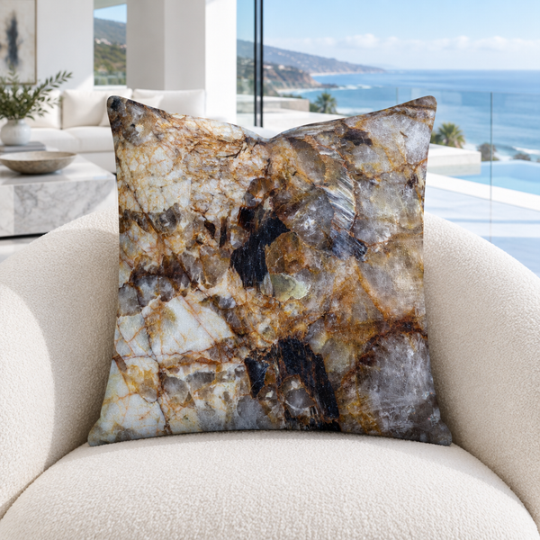 Granite pillow in a cool-white modern Malibu mansion with marble floors