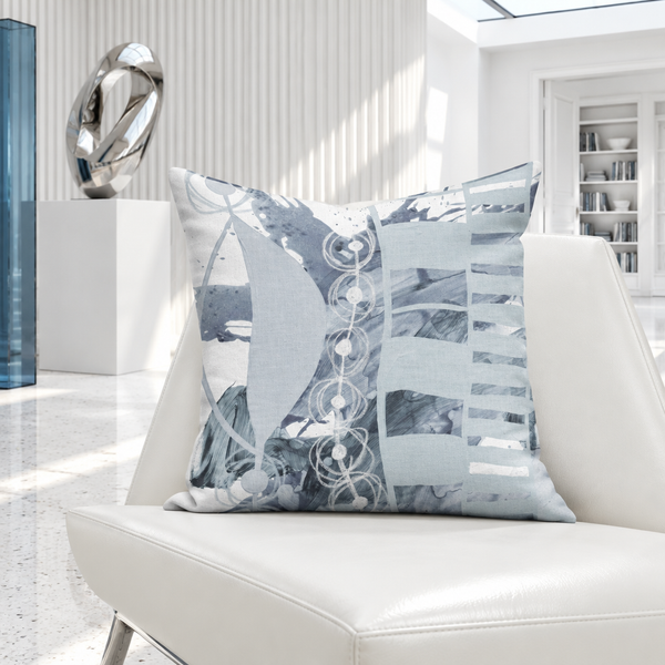 Gray pillow in a bright-white gallery room