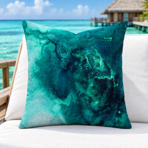 Aquatic Emerald pillow standing upright on a Maldives villa deck above a turquoise emerald lagoon