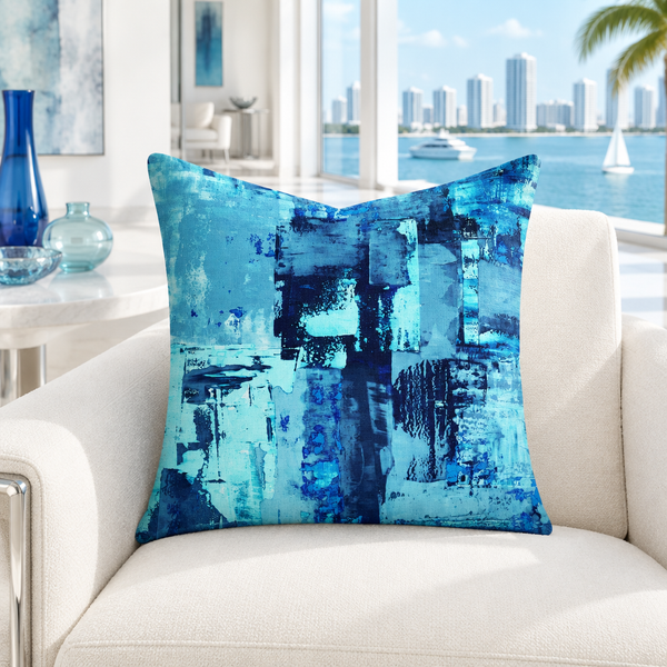 Blue 1 22-inch pillow in cool-white Miami room with blue glass