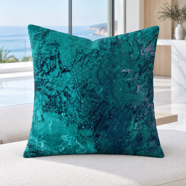 Teal pillow on a contemporary daybed in a bright Malibu home