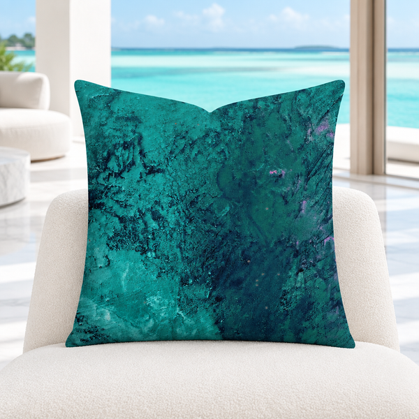 Teal pillow in a bright white Turks and Caicos villa overlooking a natural lagoon