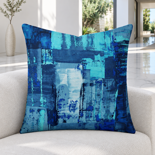 Blue 7 pillow upright in a bright Malibu courtyard home