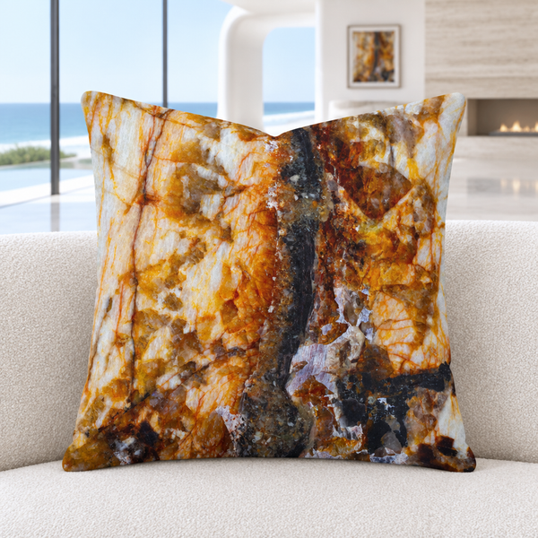 Rust Marble pillow on an ivory sofa in a modern Malibu room with distant matching artwork