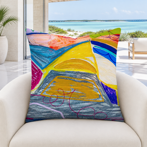 The A New Beginning 22-inch art pillow in a cool-white Turks and Caicos beach-house lounge with a natural lagoon view