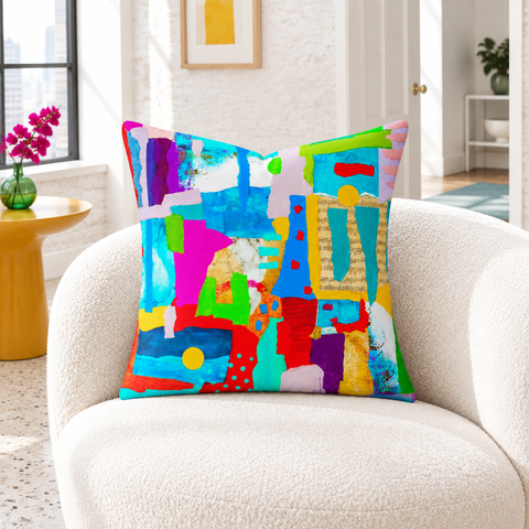 Symphony of Colors pillow in a bright white city room with saffron and emerald accents