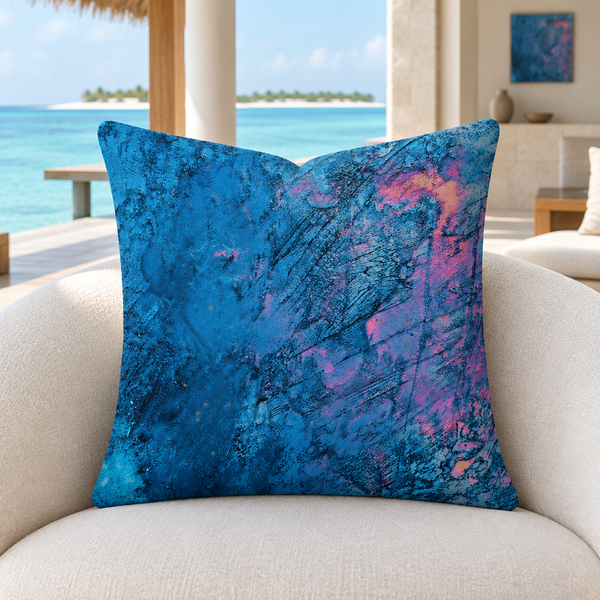 Beautiful Sky pillow upright on an ivory chair in a refined Maldives overwater villa