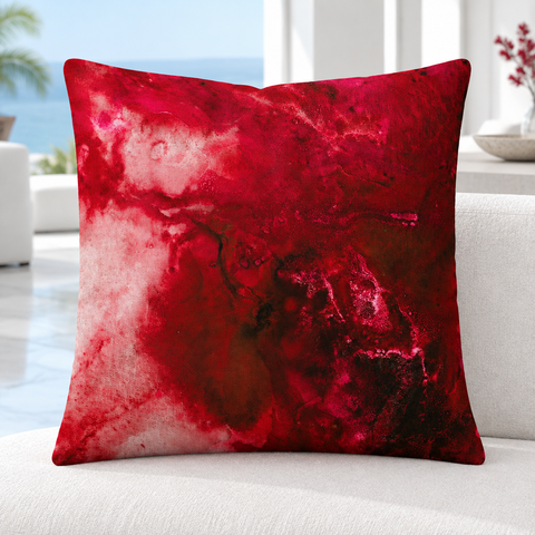 Close-up of the upright Crimson 22-inch pillow in a bright modern coastal villa