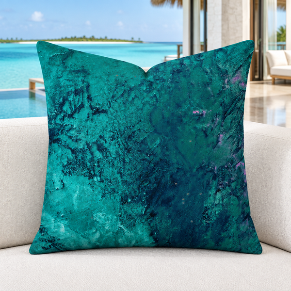 Teal pillow in a cool-white marble-floor Maldives villa with turquoise lagoon