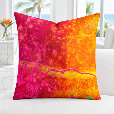 Summertime pink and orange 22-inch pillow upright in a bright-white modern Palm Beach room with white marble floor