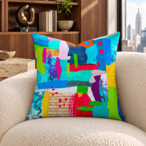 Symphony of Colors - 4 art pillow on an ivory chair in a New York apartment