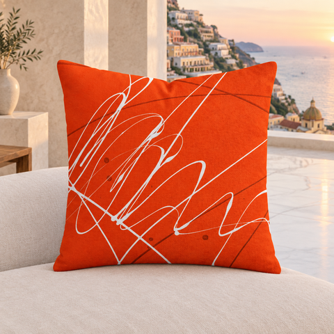Vermillion 22-inch pillow in a modern Positano villa with pale marble floors and an understated natural sunset view