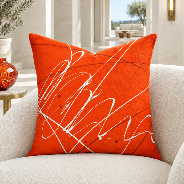 Vermillion pillow in white garden pavilion with matching orange glass