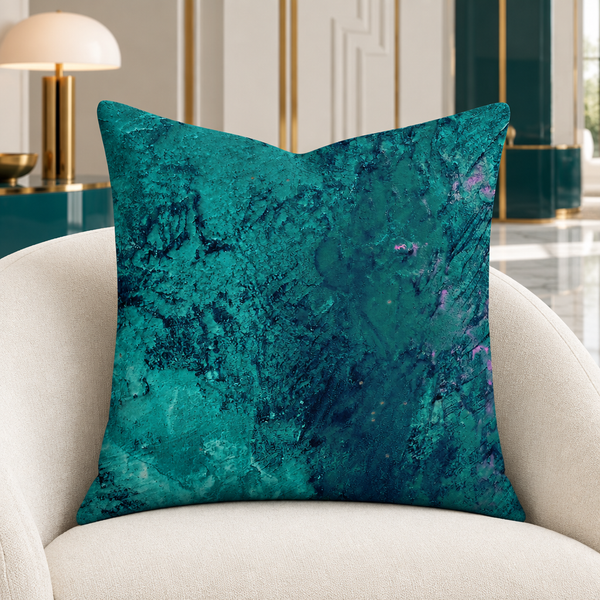 Teal pillow in a modern Art Deco-inspired suite with white marble and restrained teal accents