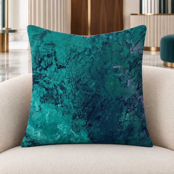 Teal pillow in a modern Art Deco lounge with marble floors and subtle jewel-tone accents