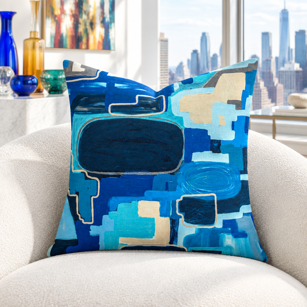 In the City 22-inch pillow in white collector room with colorful glass