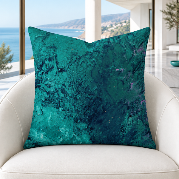 Teal pillow close-up on a white chair in a Malibu mansion