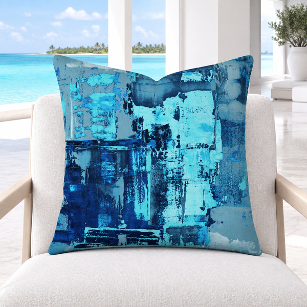 Blue 4 pillow upright in a sunlit white marble Maldives resort lounge