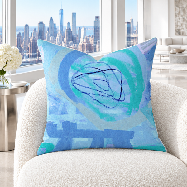 Periwinkle pillow in a cool bright white city room