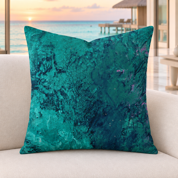 Teal pillow in a modern Maldives overwater villa with subtle sunset light