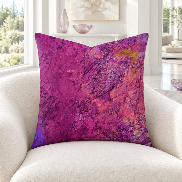 Amazing Sunset pillow in bright white room with matching pale purple glass