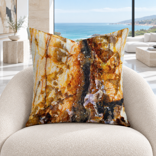 Rust Marble pillow in a bright white Malibu mansion with marble floors and a coastal view