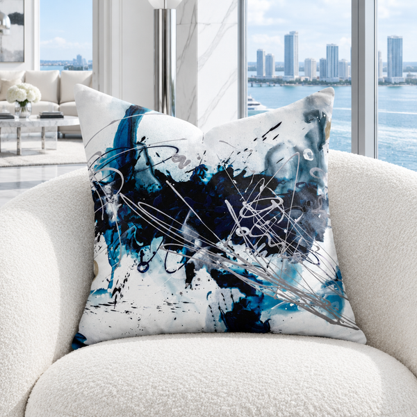 Nautical 2 A art pillow on a white chair in a cool bright waterside room