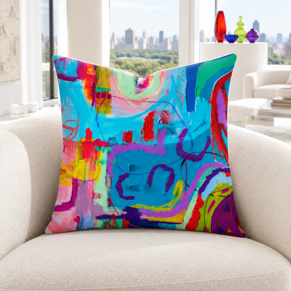 Destination Happiness 4 pillow in bright white penthouse with colorful glass