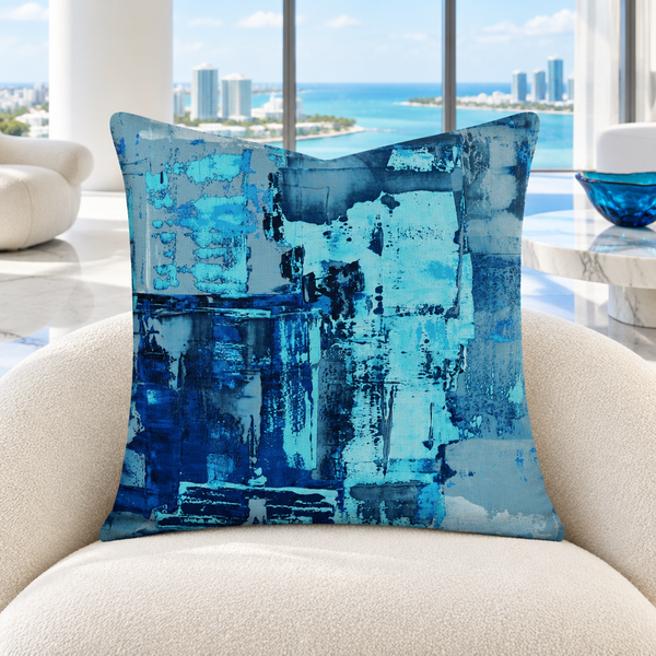 Blue 4 pillow upright in a bright white Miami penthouse with restrained print-matched accents