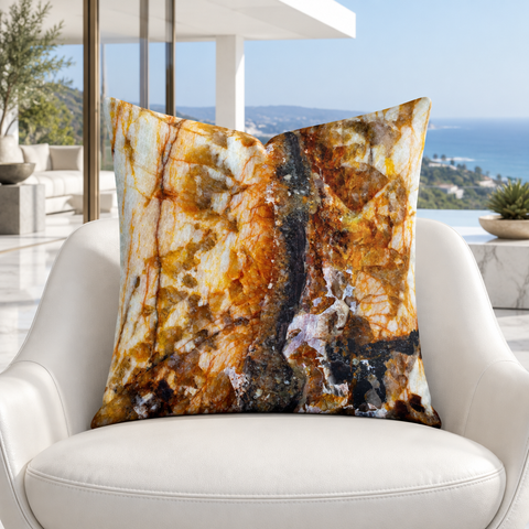 Rust Marble pillow close up on a white chair in a Malibu home