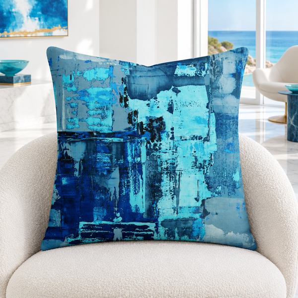 Blue 4 pillow upright in a bright white coastal room with restrained colorful details