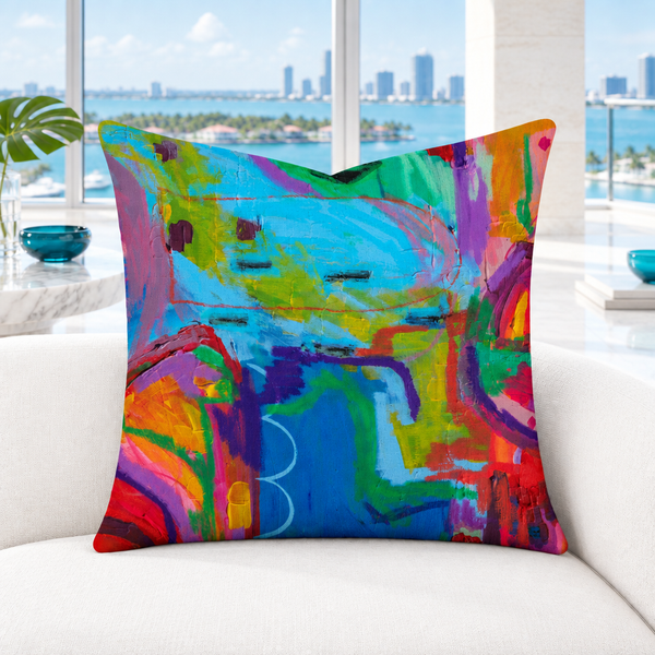 Closer view of the multicolor Destination Happiness pillow in a modern Palm Beach penthouse with white marble floor
