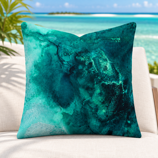 Aquatic Emerald pillow standing upright on a Turks and Caicos terrace above an emerald turquoise lagoon