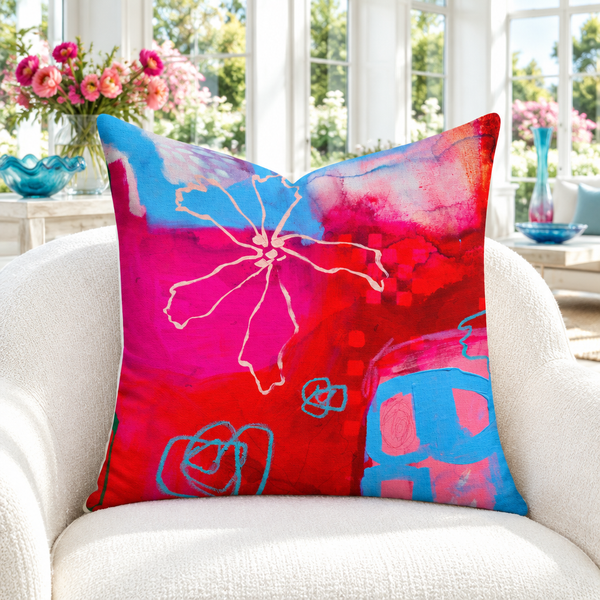 The Secret Garden 22-inch pillow close-up in white sunroom with colorful flowers