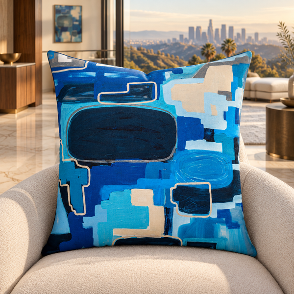 In the City pillow upright in a warm Hollywood Hills mansion with distant matching artwork