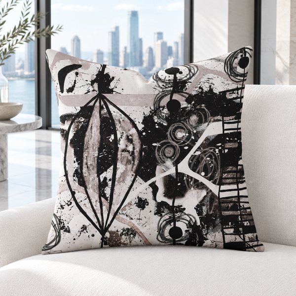 Modern Black White and Taupe pillow upright in a bright white marble city resort penthouse