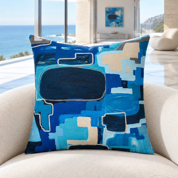 In the City pillow upright in a cool-white Malibu oceanfront mansion with distant matching art