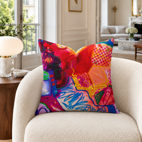 A Vibrant Life - 3 pillow on an ivory chair in a Paris apartment