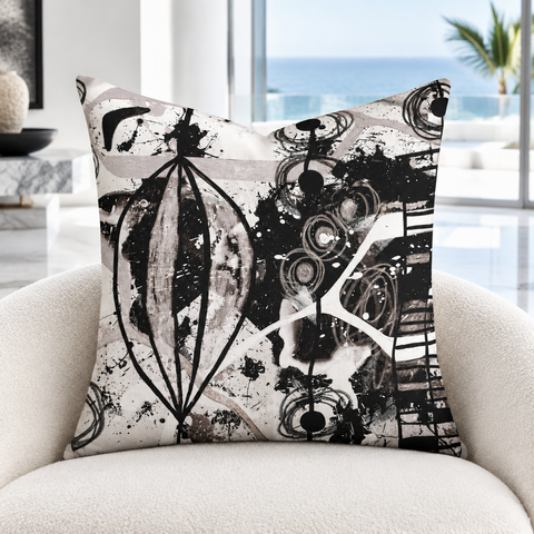 Modern Black White and Taupe pillow in a bright white coastal resort suite