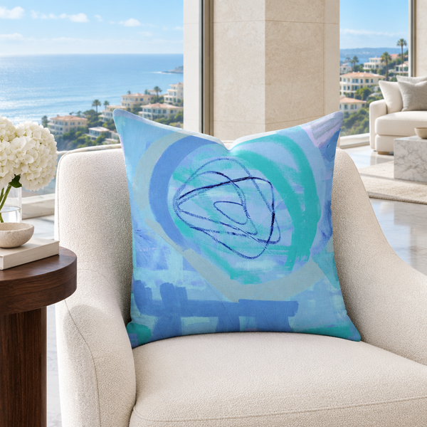 Periwinkle pillow in a coastal collector’s lounge