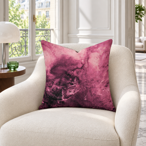 Rose 22 x 22 pillow slouched on an ivory chair in a Paris collector's salon