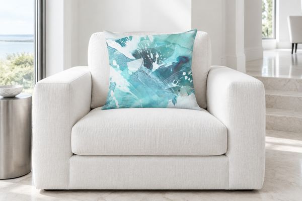 Single Aquatic Sea Glass Aqua pillow on an oversized white chair