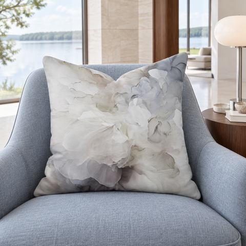 Whisper 22 x 22 pillow slouched on a blue chair in a luxury lakeside lounge